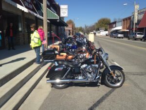 Long line of beautiful bikes.